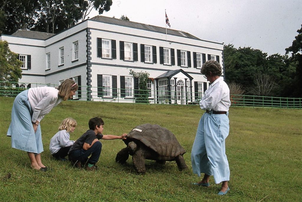 Admiring Jonathan, the Seychellois turtle and nearly 200 years old, on the grounds of Plantation House. * Photo: Ted Scull