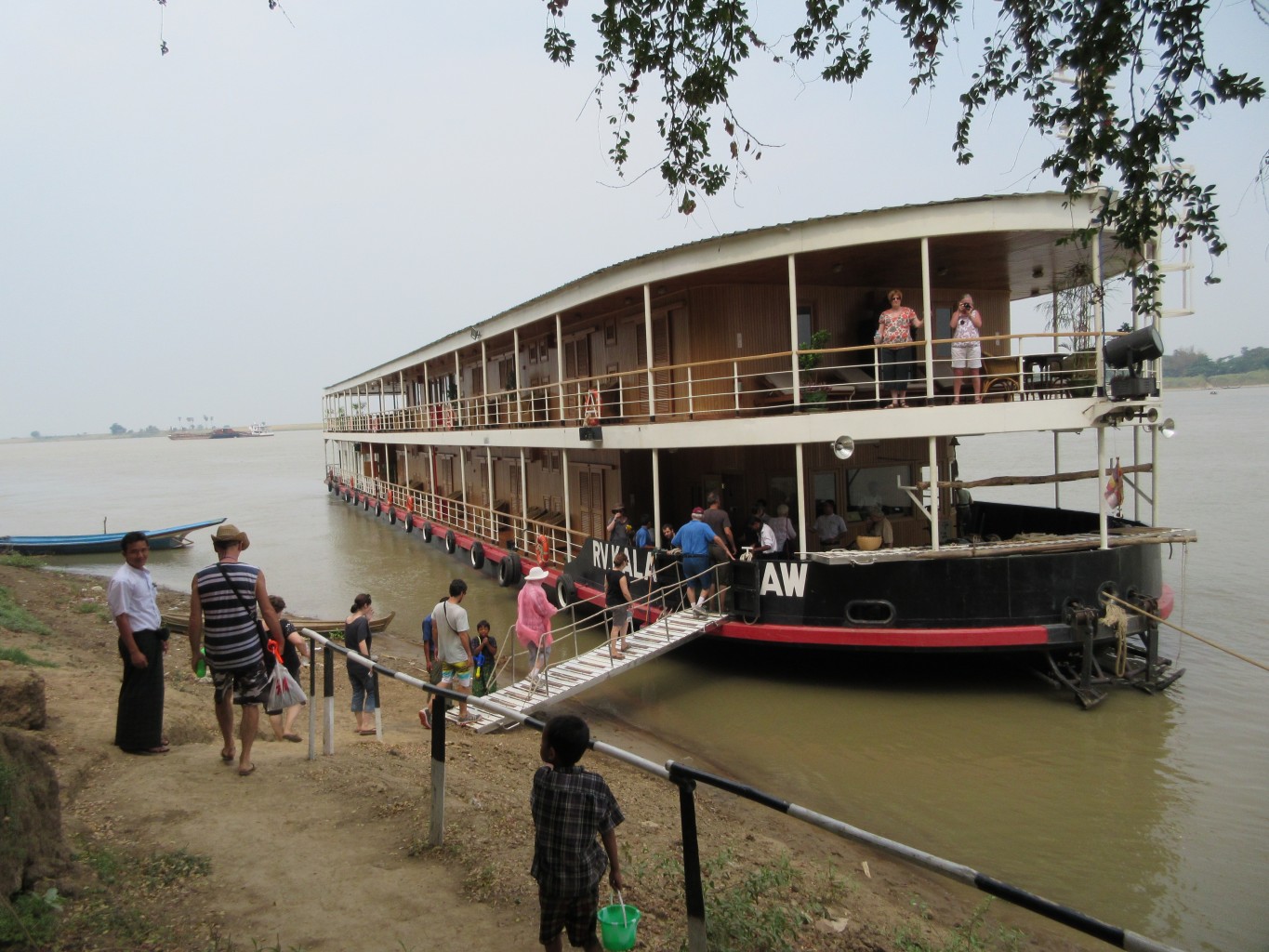 The trip to the ship. The Kalaw Pandaw tied up along the Irrawaddy. * Photo: Heidi Sarna