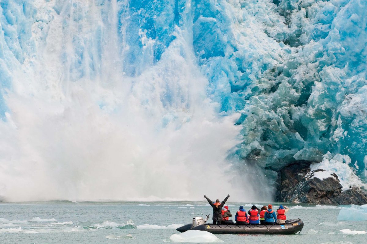 Guests get up close to a calving glacier in Southeast Alaska, at the Sawyer Glacier. 