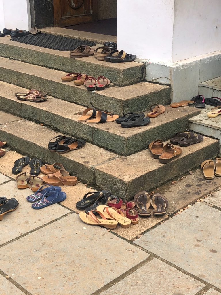 removing your shoes before going into temples