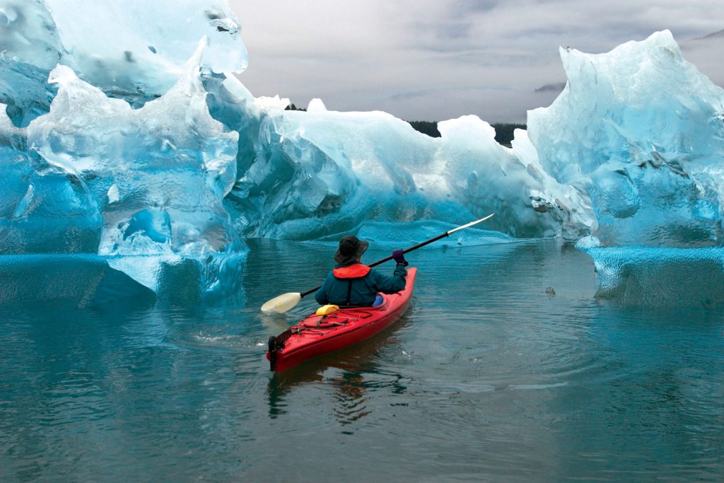Kayaking amid ice in Alaska