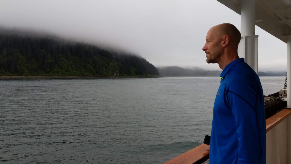 John on deck of Legacy in Alaska