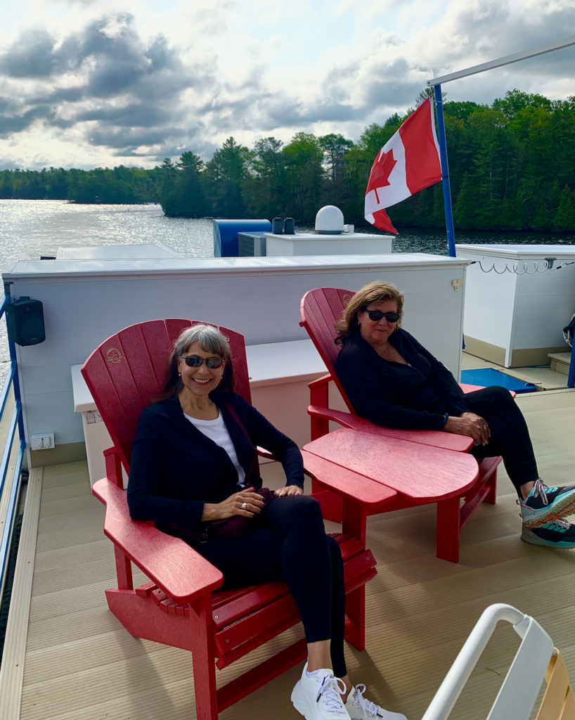 Judi & Marla chilling on deck cruising Canada's Rideau Canal