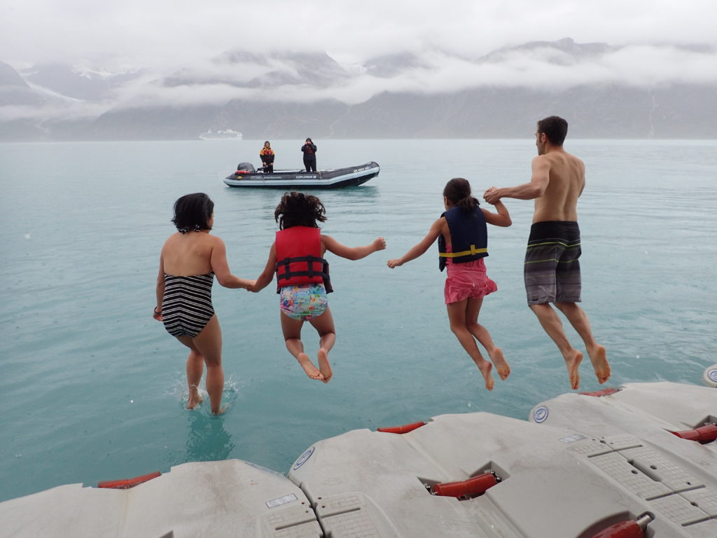 Family braving the polar plunge in Alaska on an UnCruise