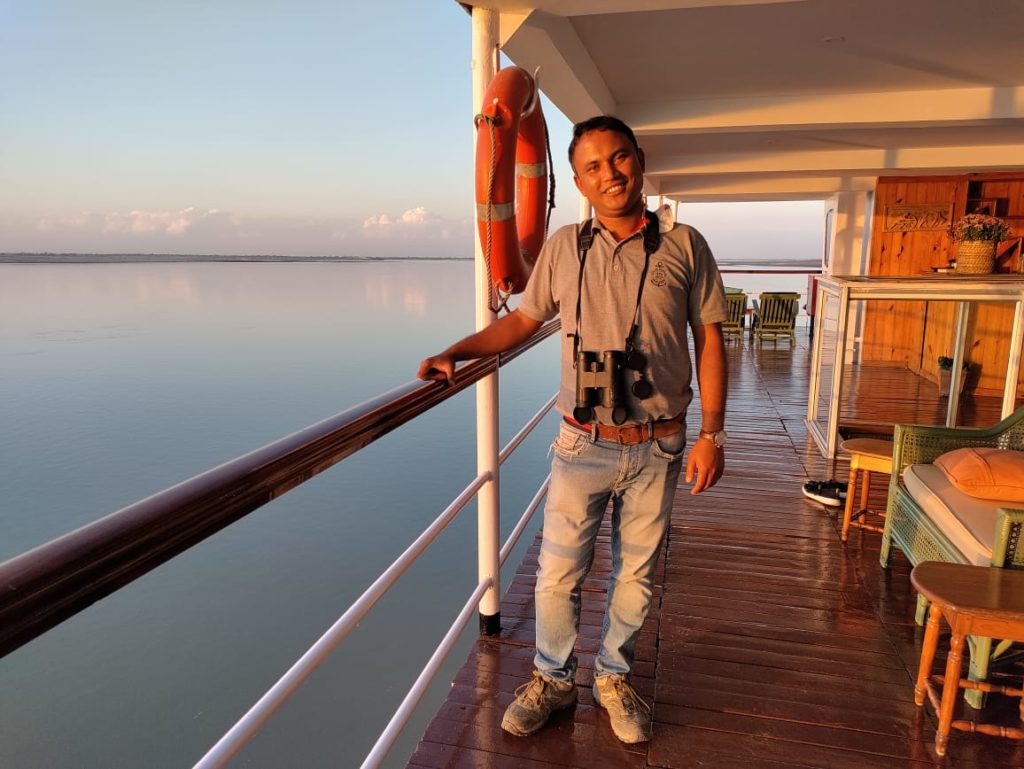Tour guide Mohan on Sukapha on Brahmaputra River Cruising