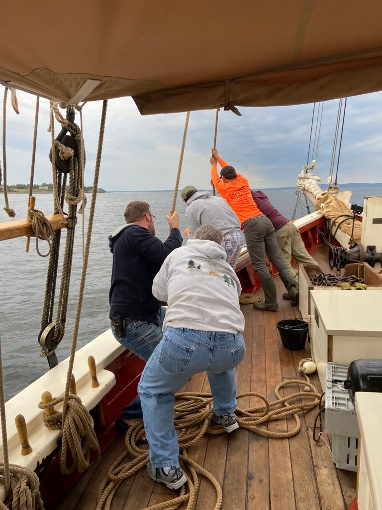 Raising the heavy anchor of the Riggin Maine Windjammer