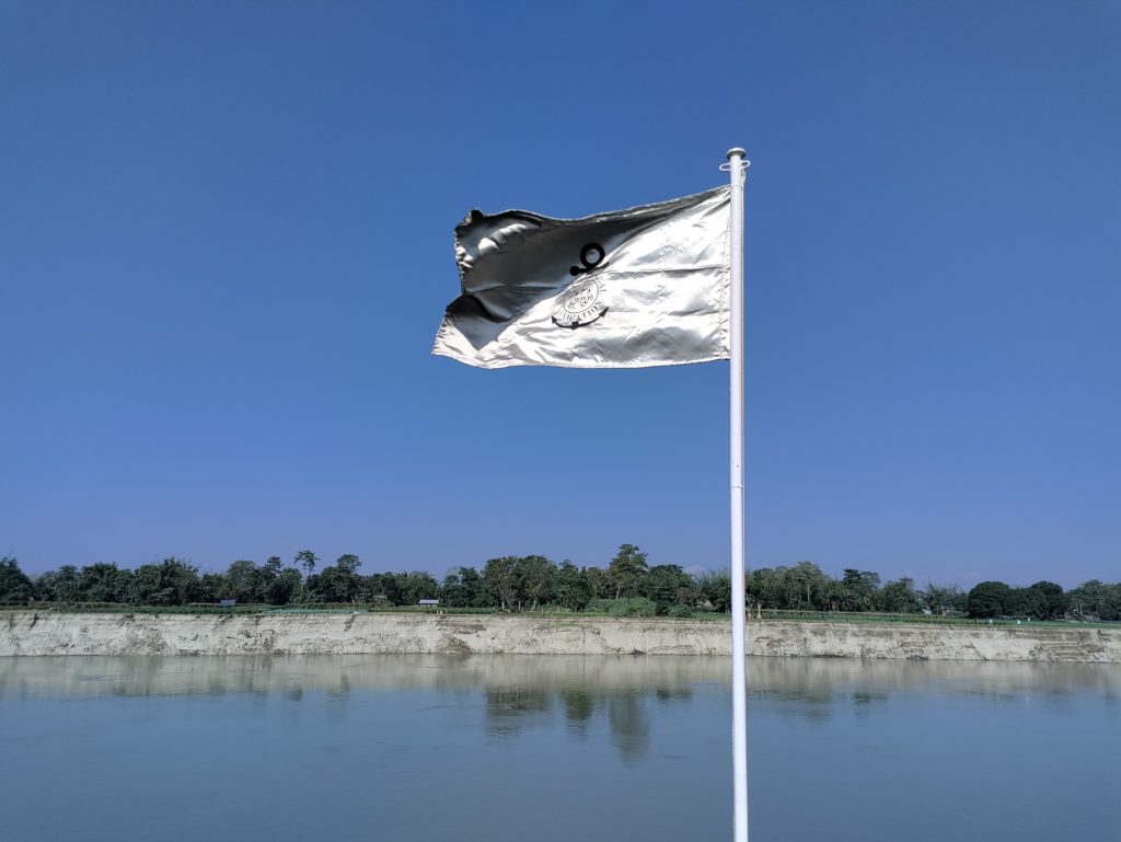 ABN flag against island with high sand cliff
