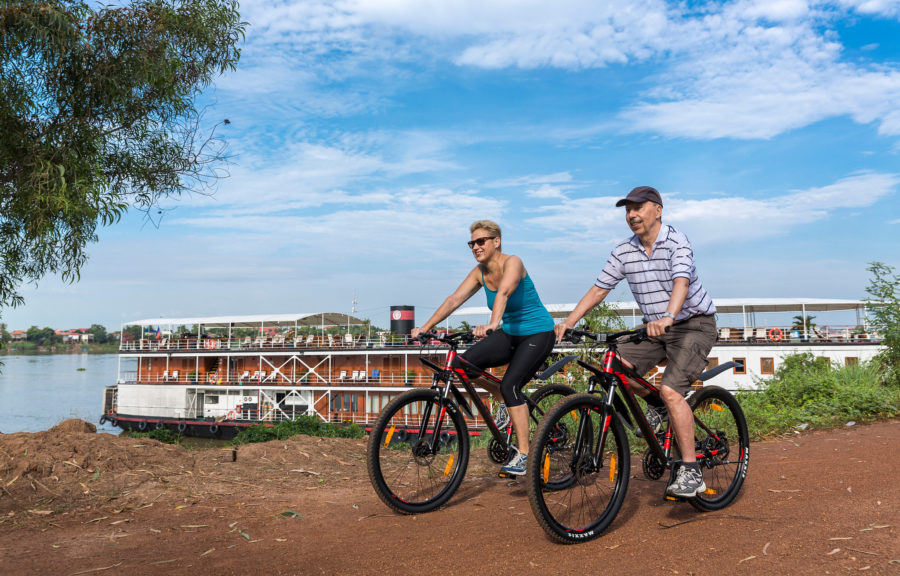Southeast Asia is welcoming travelers again, some of whom bike on a Pandaw cruise