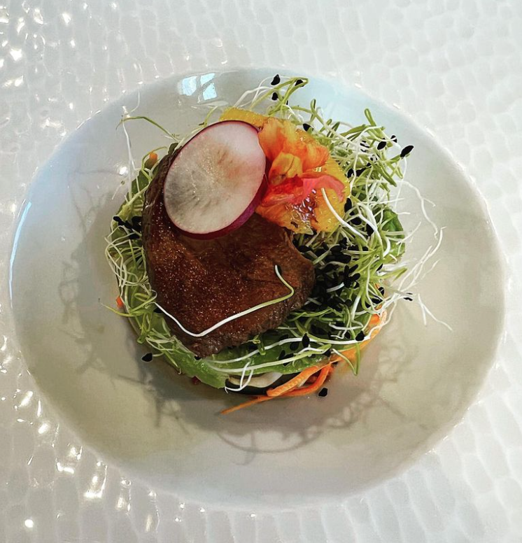 Luxury barge cruise dining includes Teriyaki duck and orange salad