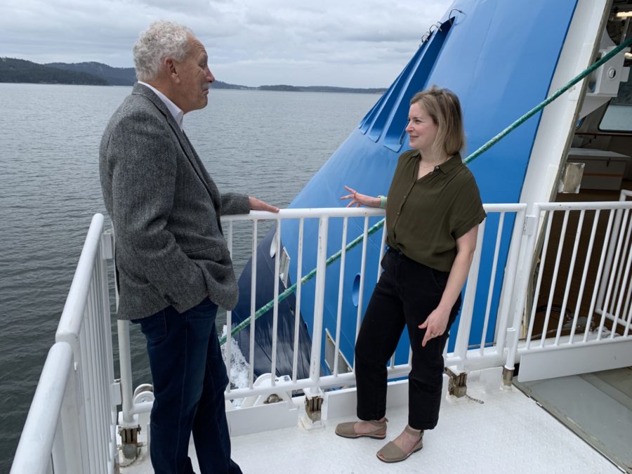 John Waggoner with a whale expert on American Queen Voyages Ocean Victory