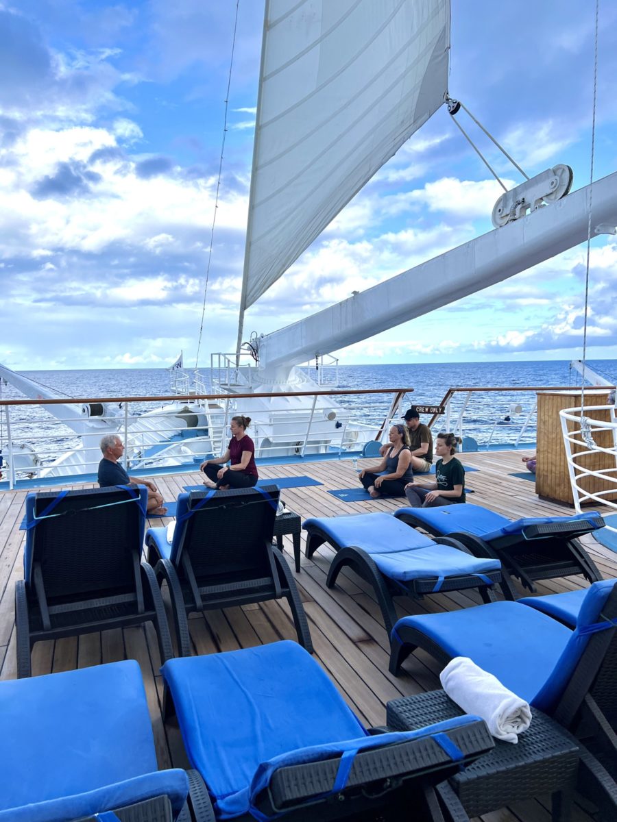 early riser yoga class on Wind Spirit on a Tahiti cruise