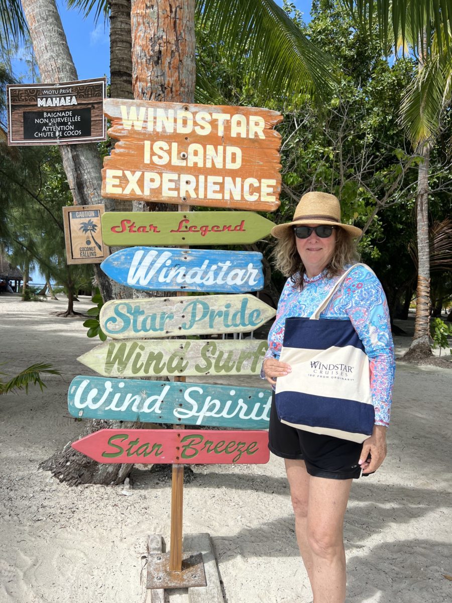 Windstar Tahiti cruise review author posing at Windstar's Motu Mahaea private island