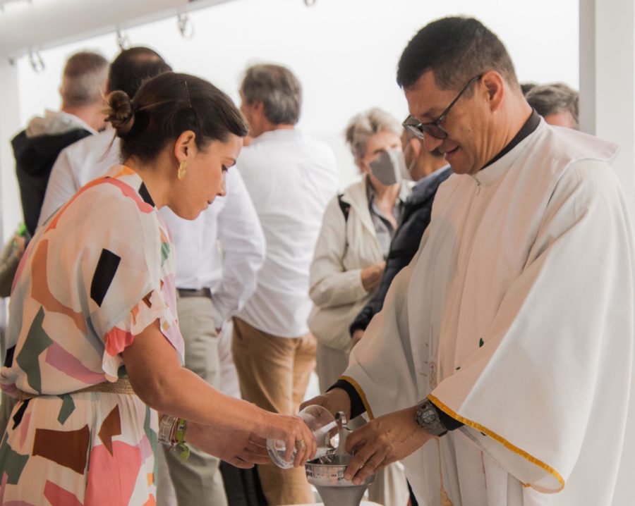 Preparing holy water for the blessing of new Galapagos ships Nat Geo Islander II