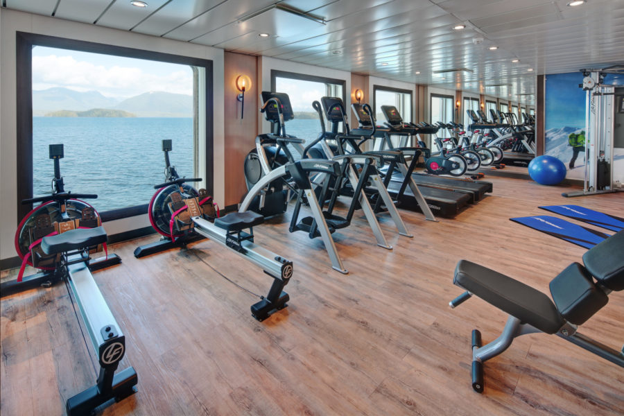 The sea-view fitness center on American Queen Voyages Ocean Victory