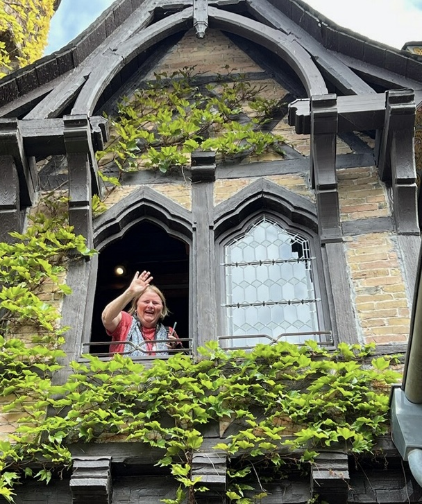 Terri waving hello from a castle on the Moselle River