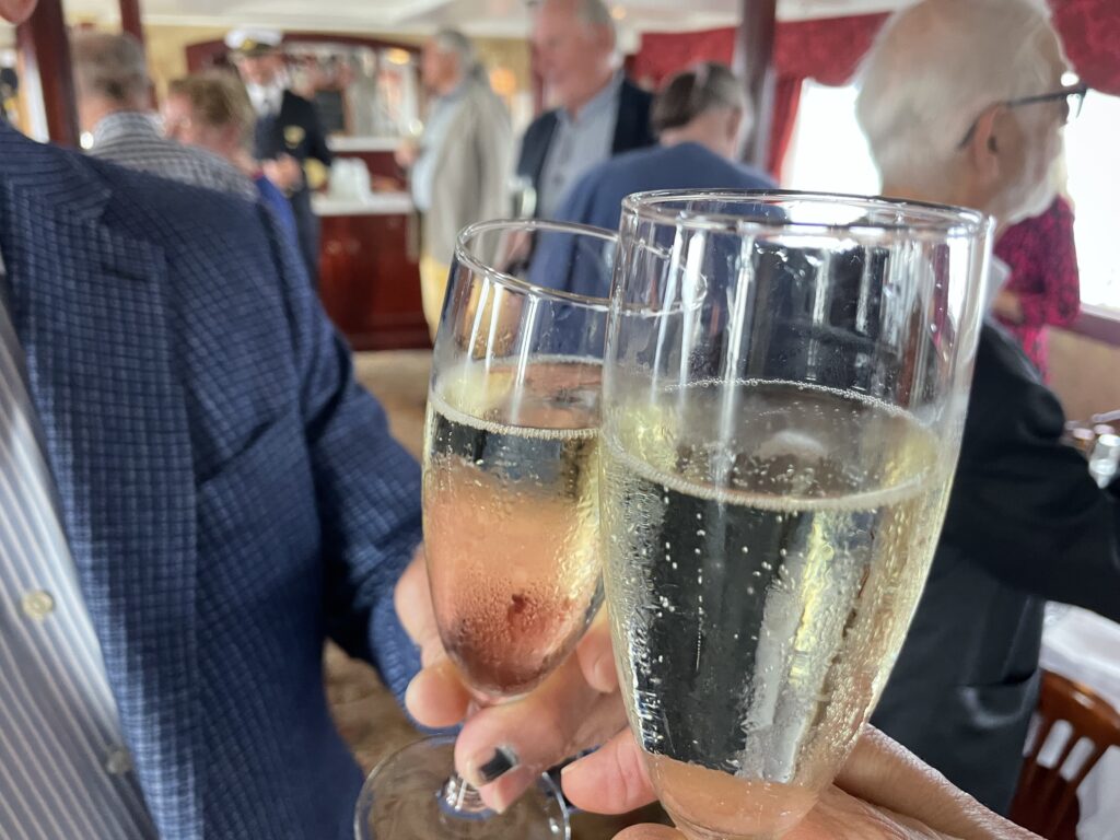 farewell champagne toast on MV Diana