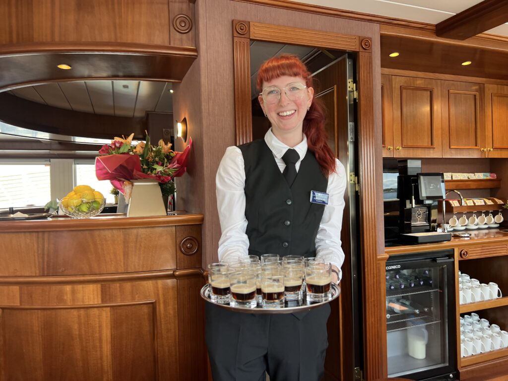 Ashely serving drinks on Lord of the Highlands