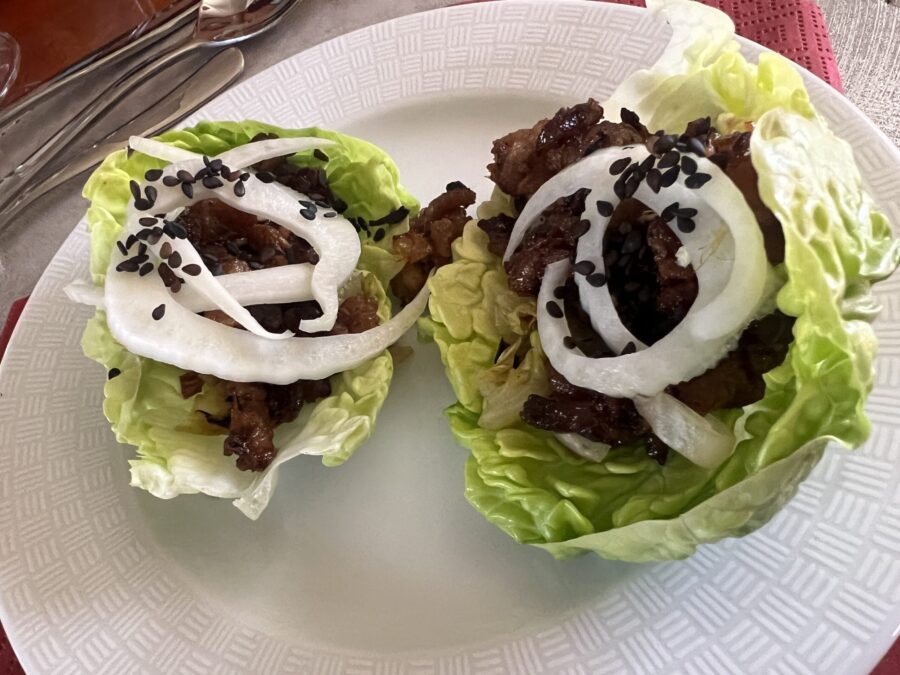 Crispy pork in a lettuce taco on a Lucy Mary cruise