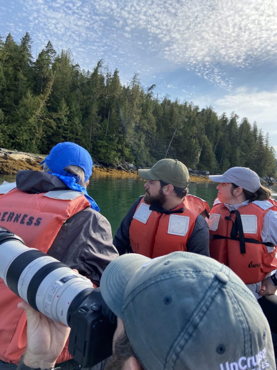 Spotting a bear shoreside on an UnCruise skiff excursion