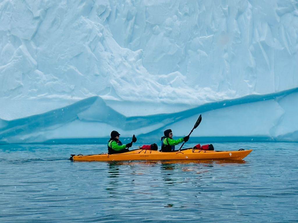 Jerrol and friend Cherie kayaking on a Greg Mortimer Antarctica cruise