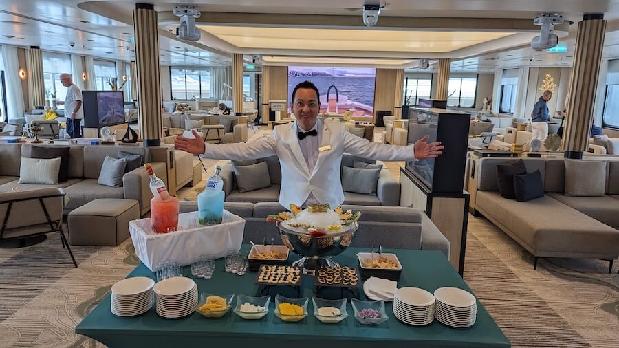 Aaron. sets up caviar and Vodka drinks aboard Diana