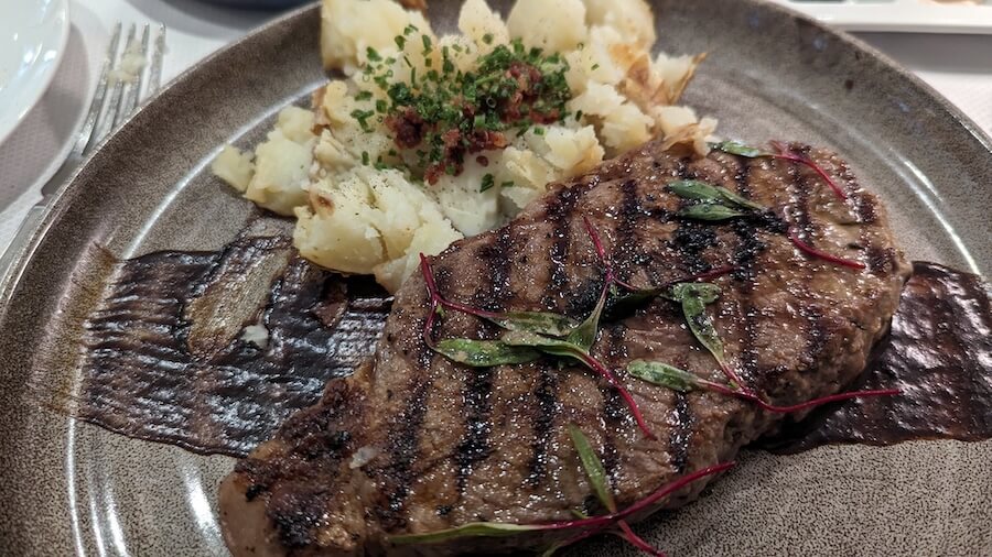 A steak in Candles on a small ship Japan cruise with Windstar