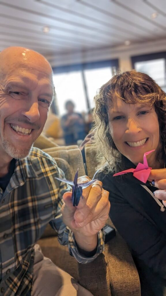 John & Colleen in the origami class on a Winddstar cruise