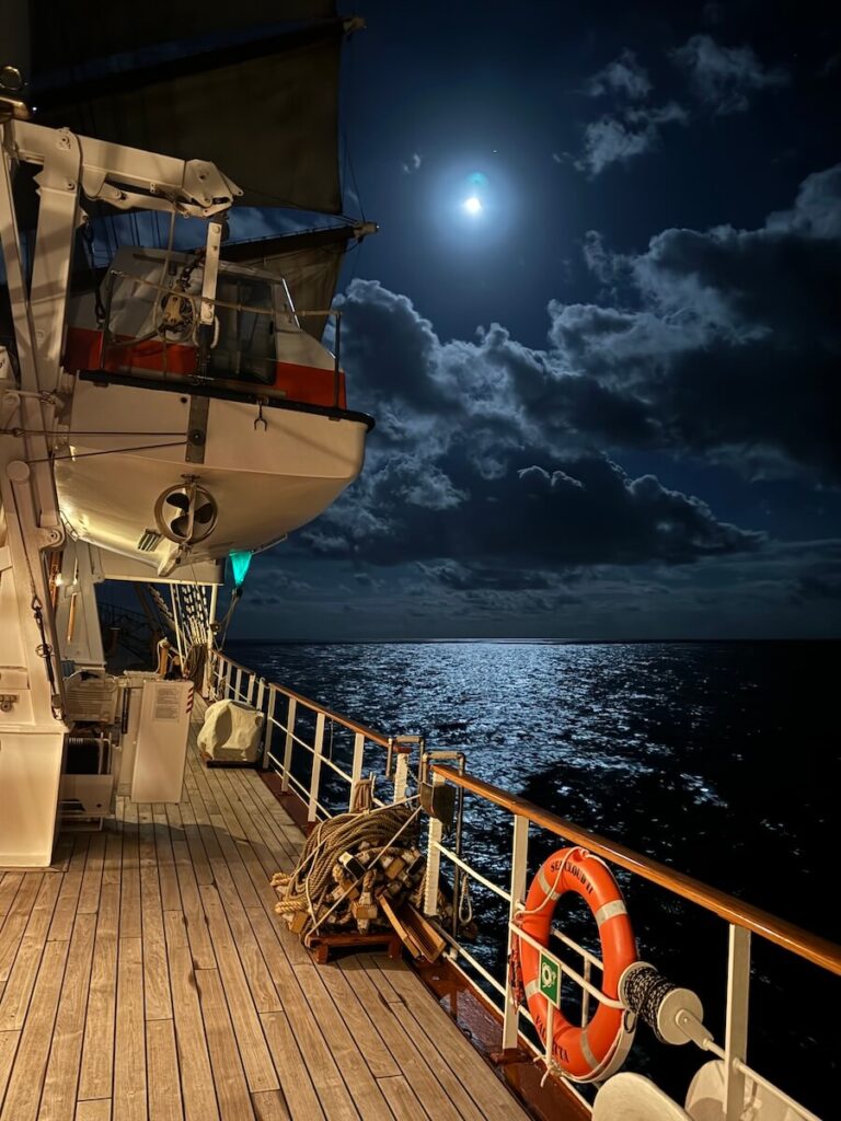 Full moon under sail.