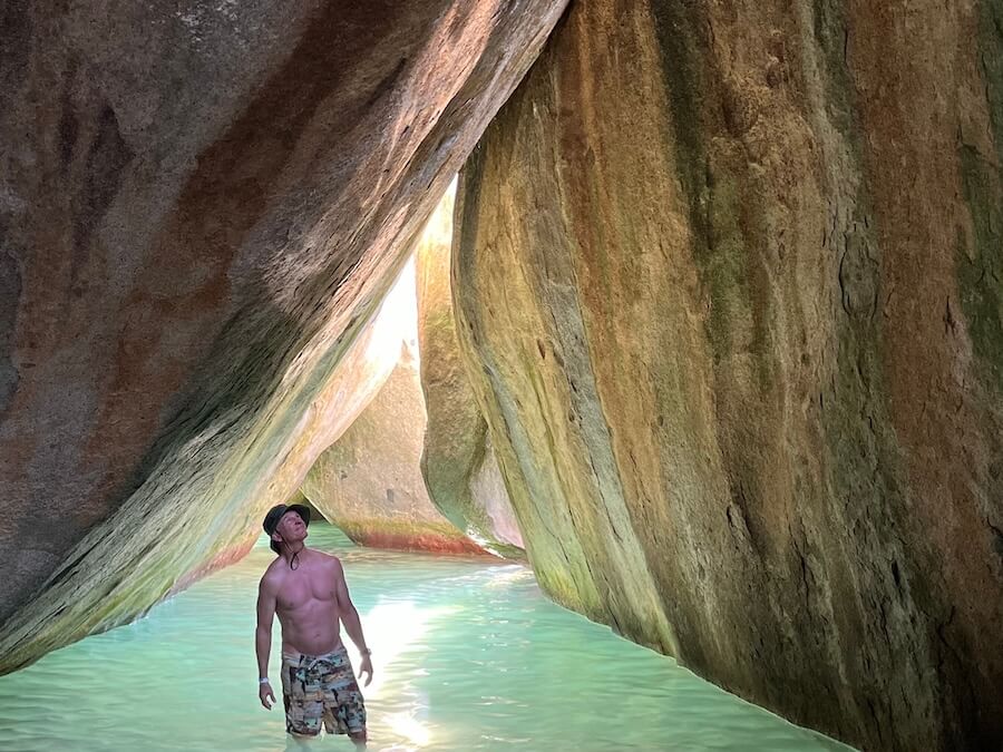 Wading under the dramatic rock formations of Virgin Gorda’s Baths on a Sea Dream II cruise