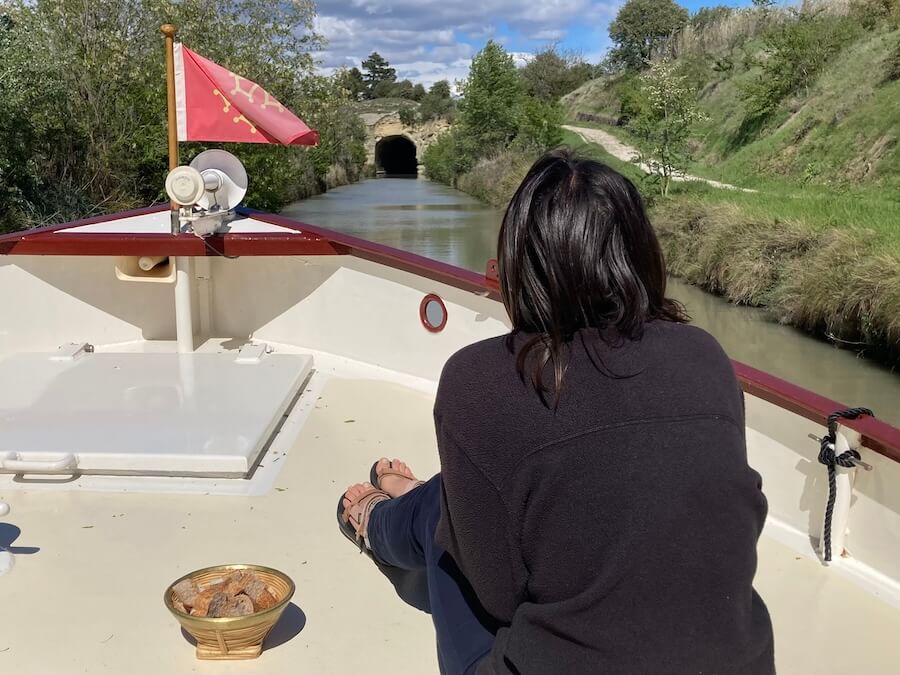 Chumming for catfish on a barge cruise