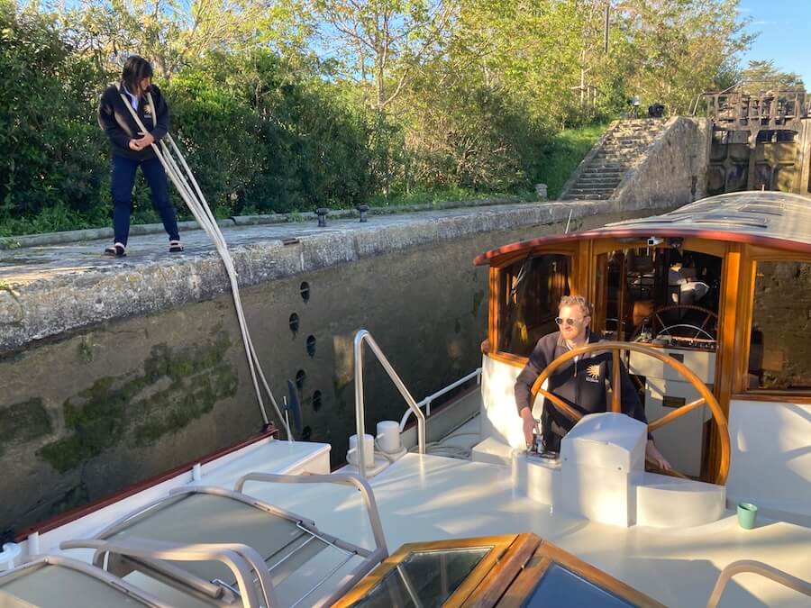 Here Becky wears the lines like a necklace at the Fonserannes Lock Staircase on a Roi Soleil Barge Cruise