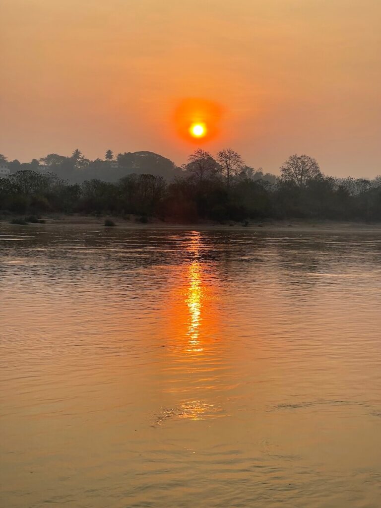 Sunset on the Upper Mekong on a Cruise Mekong Laos adventure