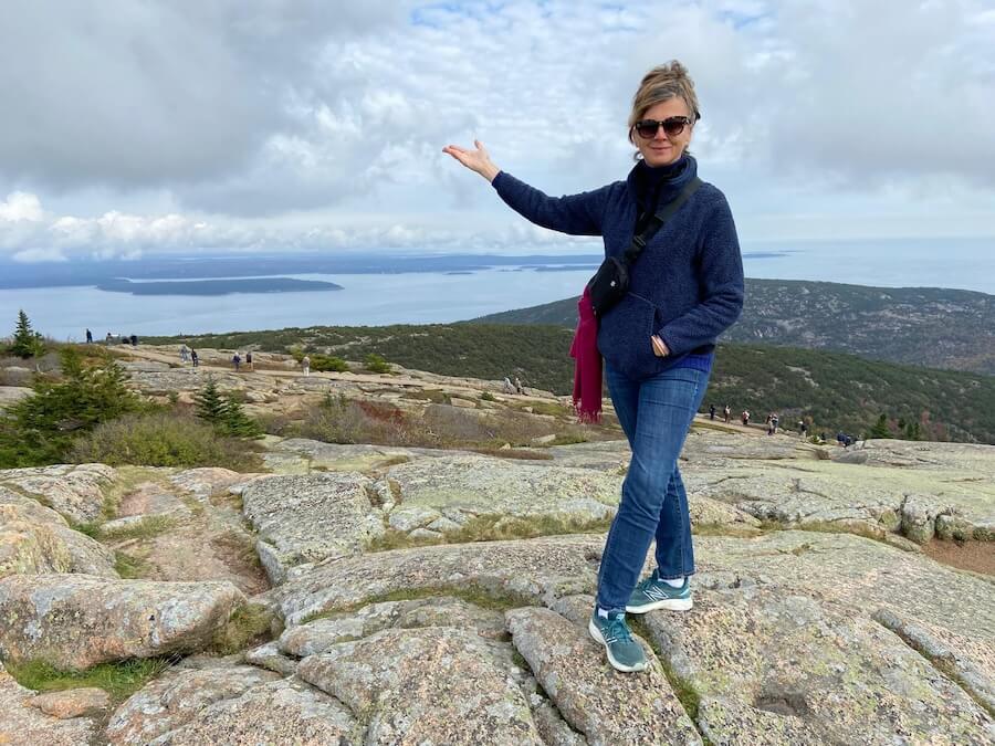 Heidi posing in Acadia National Park on a Maine American Cruise Lines on a coastal cruise