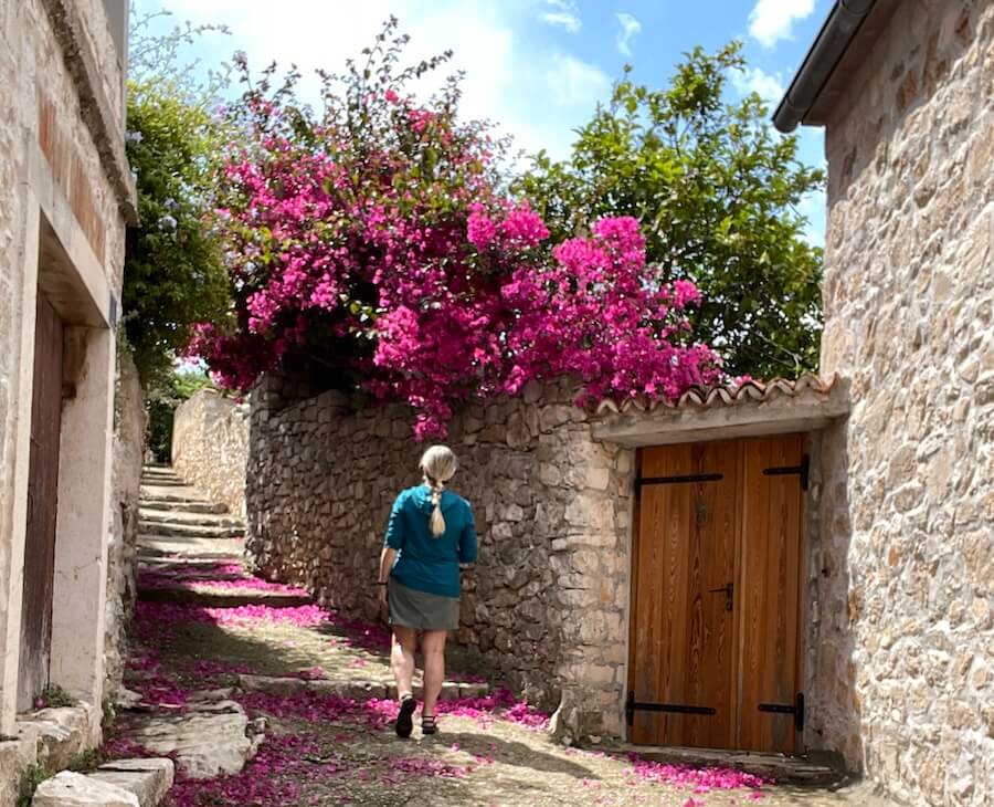 walking bougainvillea filled alleyways of Vis on a Croatia Yacht Cruise