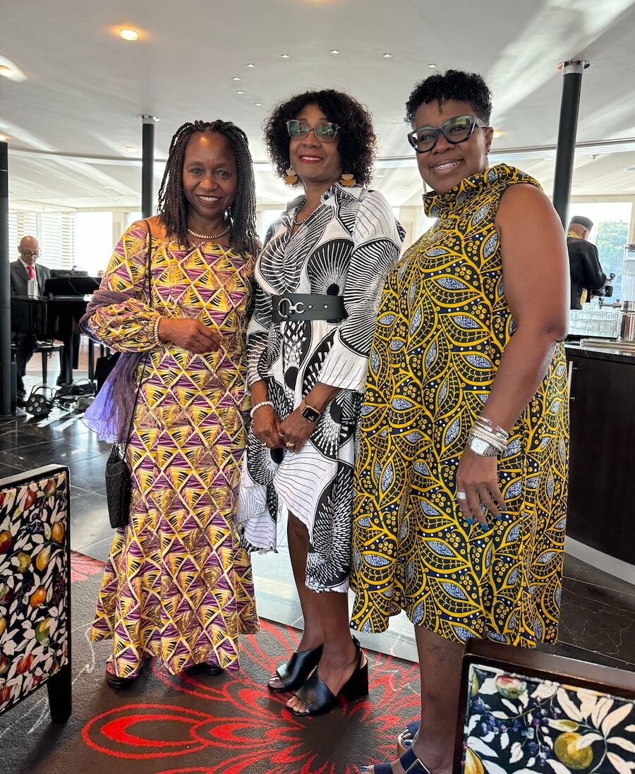 Cheryl flanked by Patricia Yarbrough (left)., and Regina Broadnax (right) of Festival at Sea cruises