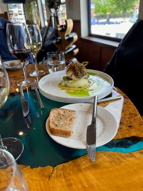 Hake fish at dinner on a Thames River Magna Carta cruise