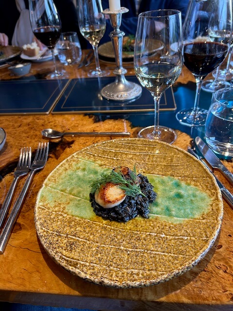 Delicious scallop appetizer on Magna Carta