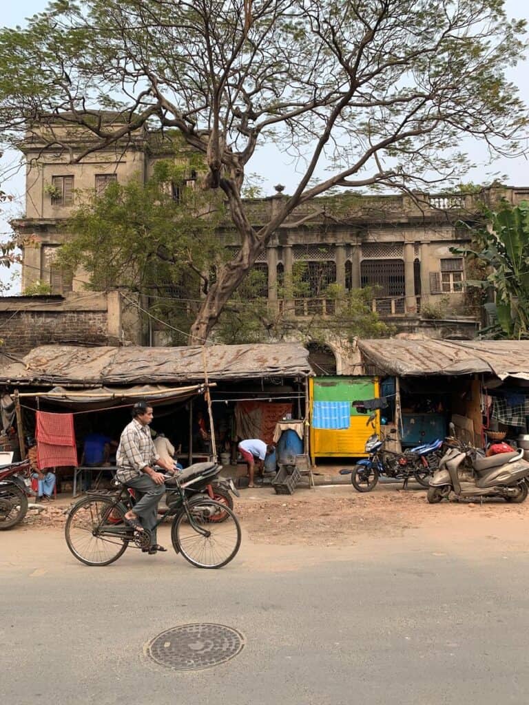Cruising India’s Hooghly River Aboard Raj Mahal — An Expert Review of a Fascinating Quirky Cruise 28 man on bicycle in India