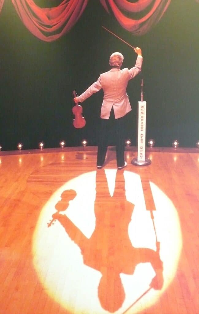 backstage photo of Opry legend Roy Acuff standin