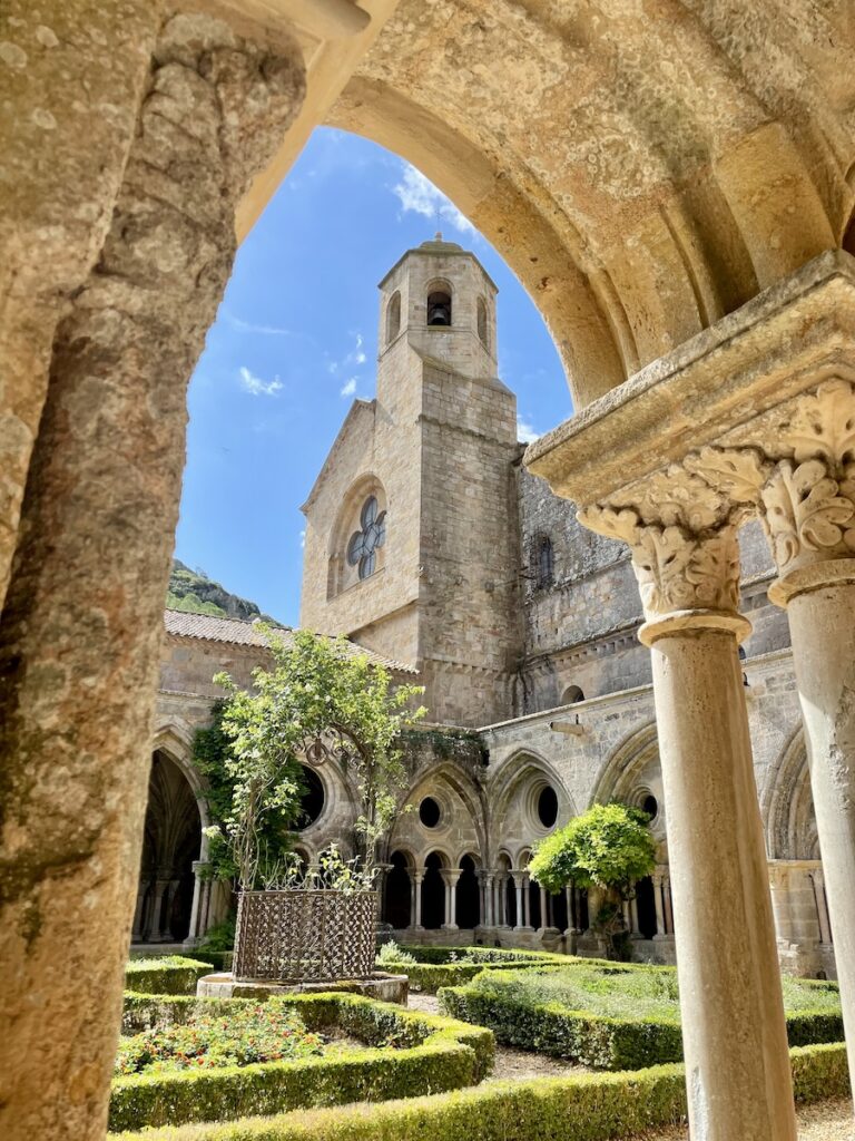 Abbaye de Fontfroide's courtyard seen an on excursion of a Canal du Midi barge cruise