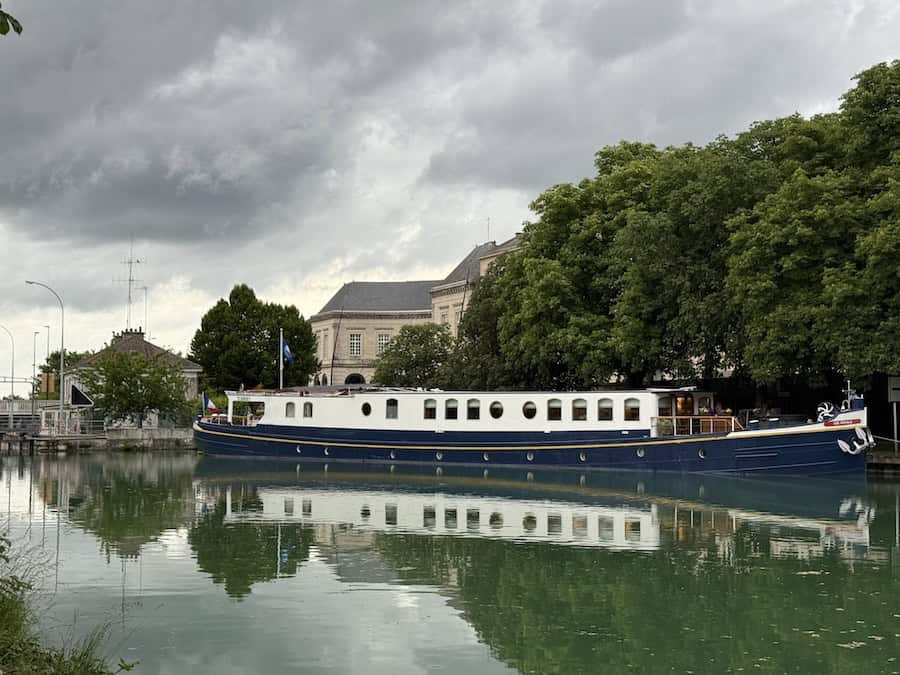 Kir Royale moored beneath dripping plane trees in Châlons-en-Champaign