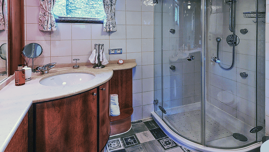 spacious en suite bathroom includes a large shower with waterjets aboard C'est La Vie