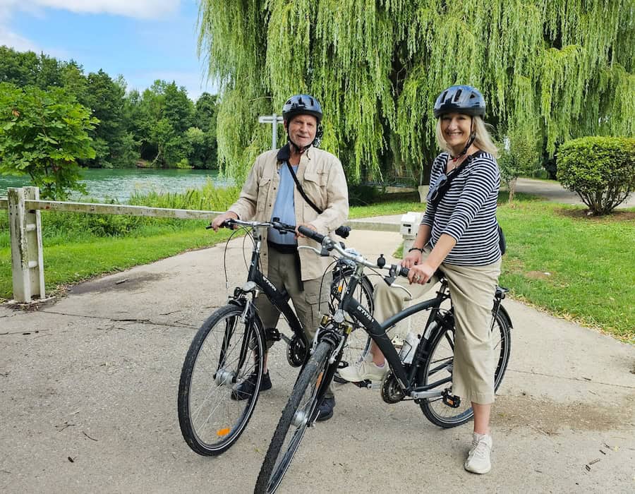 Molly & Len cycling on a C'est La Vie cruise.