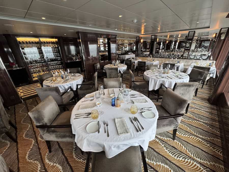 Atlas Antarctica Cruise Review (2026): At Last, On A Real Expedition Ship, the World Navigator 12 The Porto Restaurant is covered in the Atlas Antarctica Cruise Review