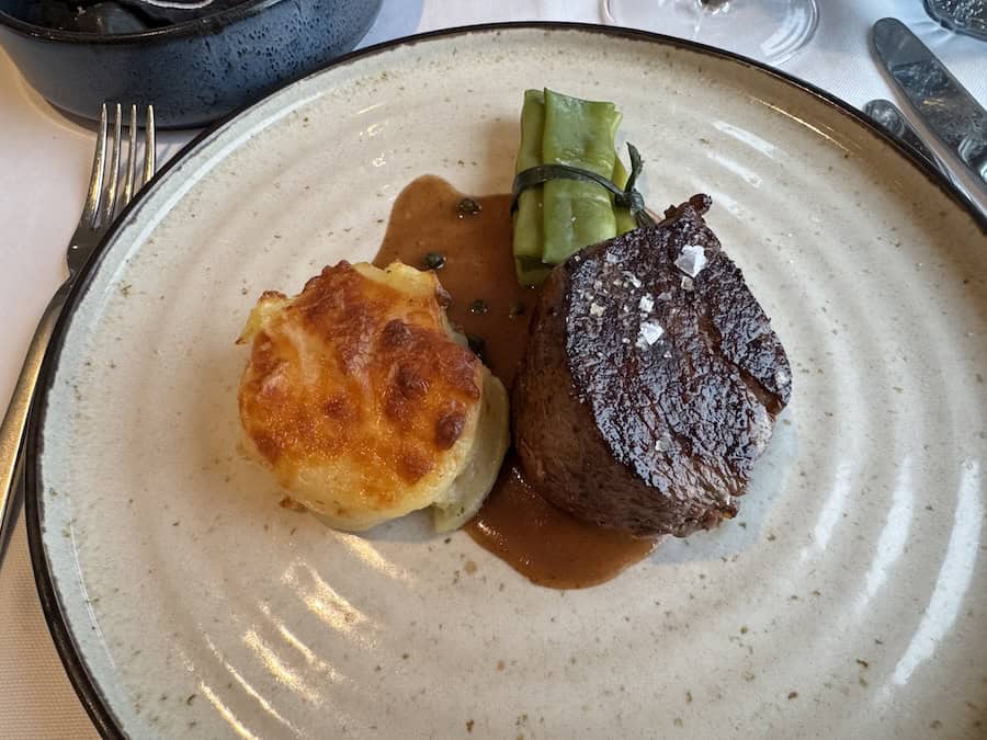 Atlas Antarctica Cruise Review (2026): At Last, On A Real Expedition Ship, the World Navigator 14 perfectly prepared filet mignon was mentioned in this Atlas Antarctica Cruise Review