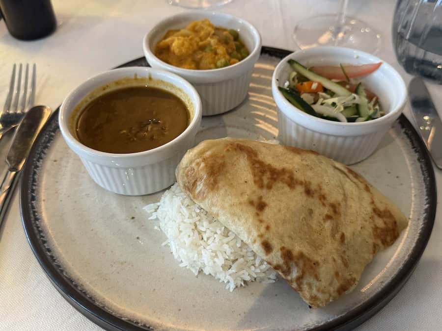 Atlas Antarctica Cruise Review (2026): At Last, On A Real Expedition Ship, the World Navigator 15 Atlas Antarctica Cruise Review includes info on food like Indian Thali