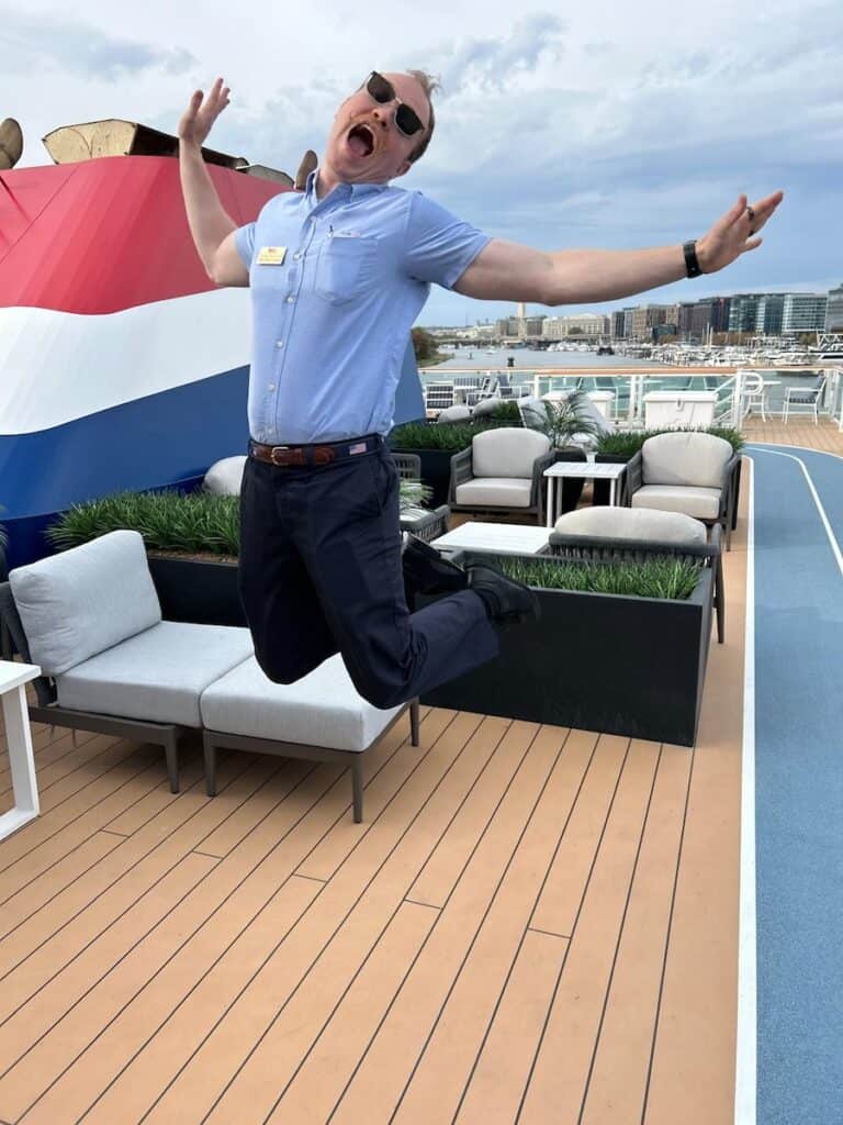 An enthusiastic crew member aboard the Chesapeake Bay Cruise With American Cruise Lines