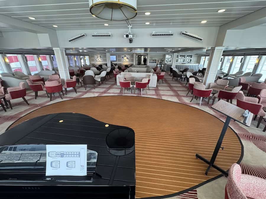 The Sun Lounge doubles as a pleasant lounge for cocktails or a quiet read and an auditorium for enrichment presentations, shore excursion info and guest musicians; shot while Winter Cruising On The Lower Mississippi With American Cruise Lines