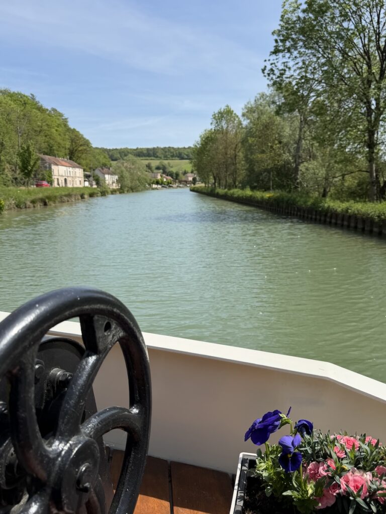This French Barge Is Different (2026 REVIEW) — Choose The Savoir Vivre On The Burgundy Canal For The Cycling & Dinners Ashore 10 The Savoir Vivre slowly moving through the Burgundy Canal.