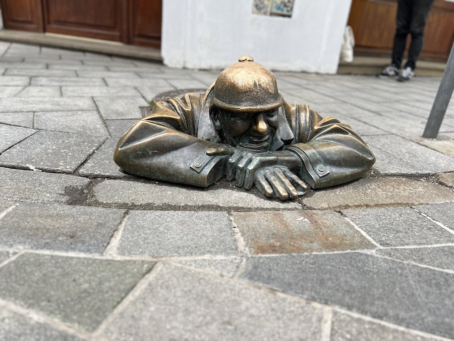 Cruising The Capital Cities Of The Danube On Uniworld’s Newest Ship (2026 REVIEW) 25 "Cumil the Sewer Worker" statue in Bratislava
